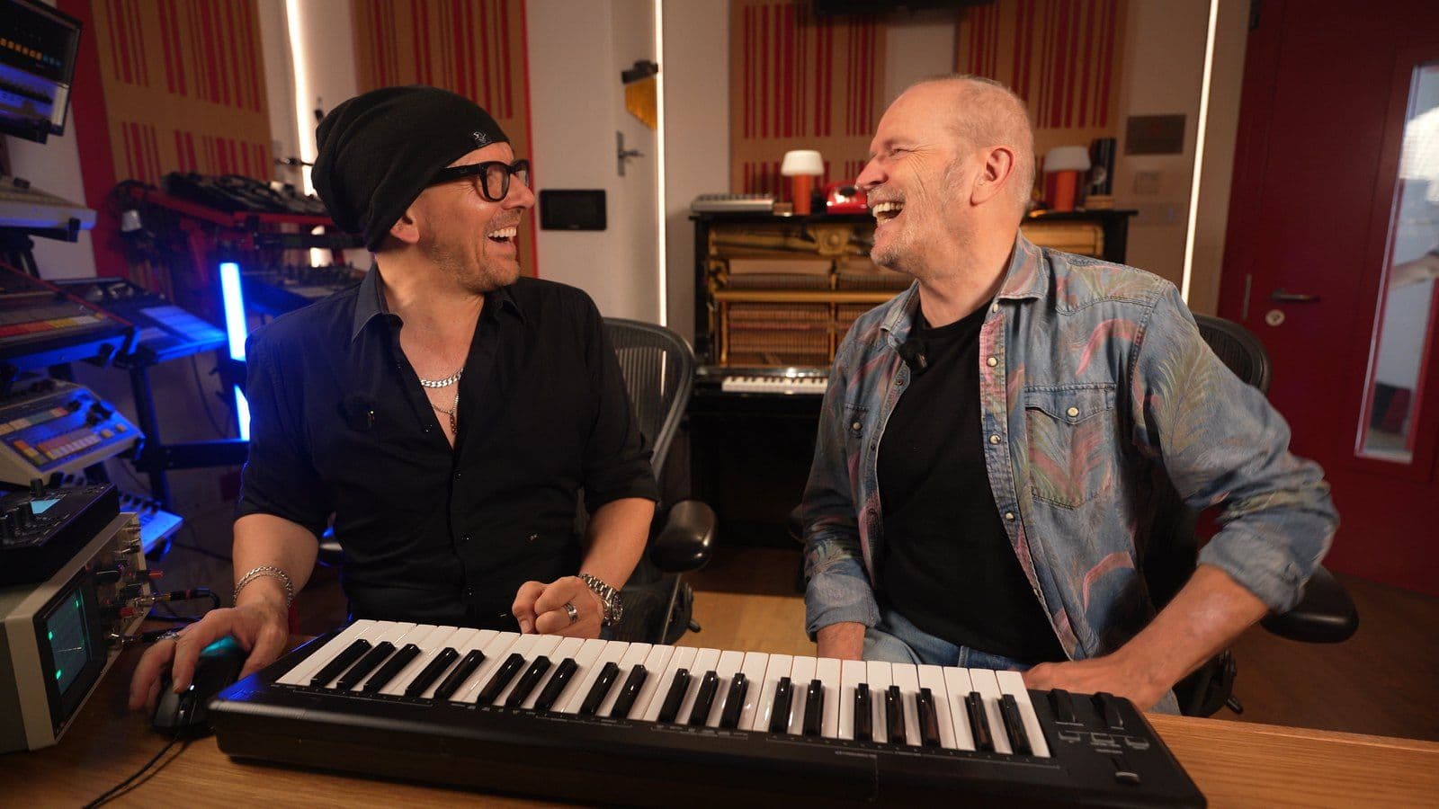 Claudio and Jam El Mar laughing at the keyboard in the Doctor Mix studio