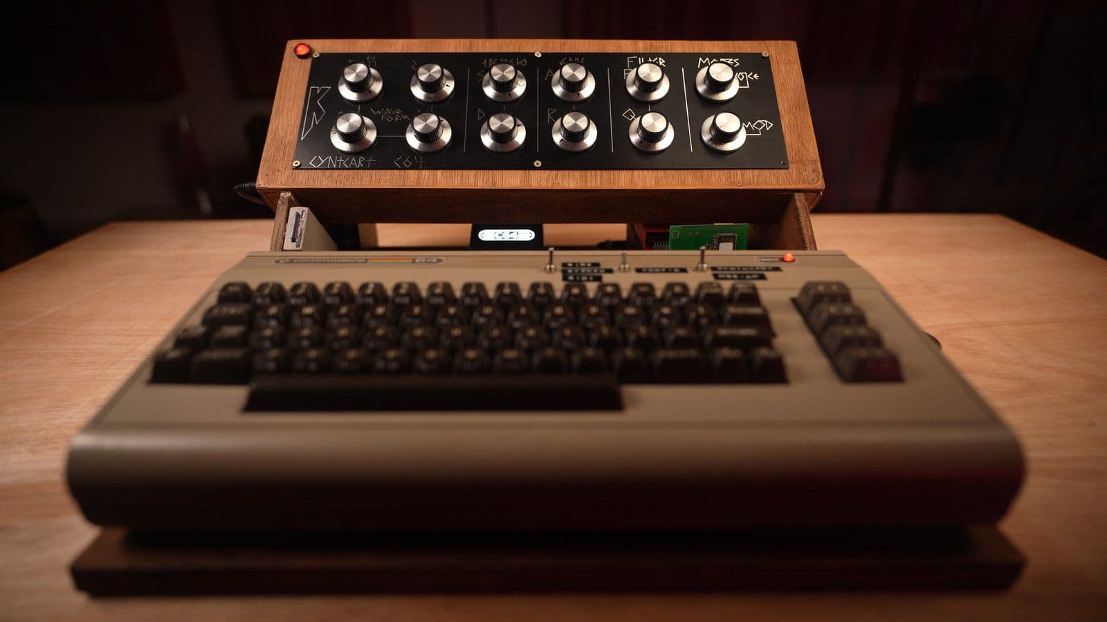 The finished Commodore 64 synthesizer with its new wooden control-panel enclosure mounted on top
